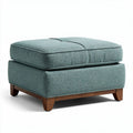Upholstered ottoman with wooden legs in teal fabric 23 x 23 x 16 inches
